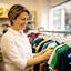 Telisa Eights, parent, browsing children's football shirts in a Norwich shop